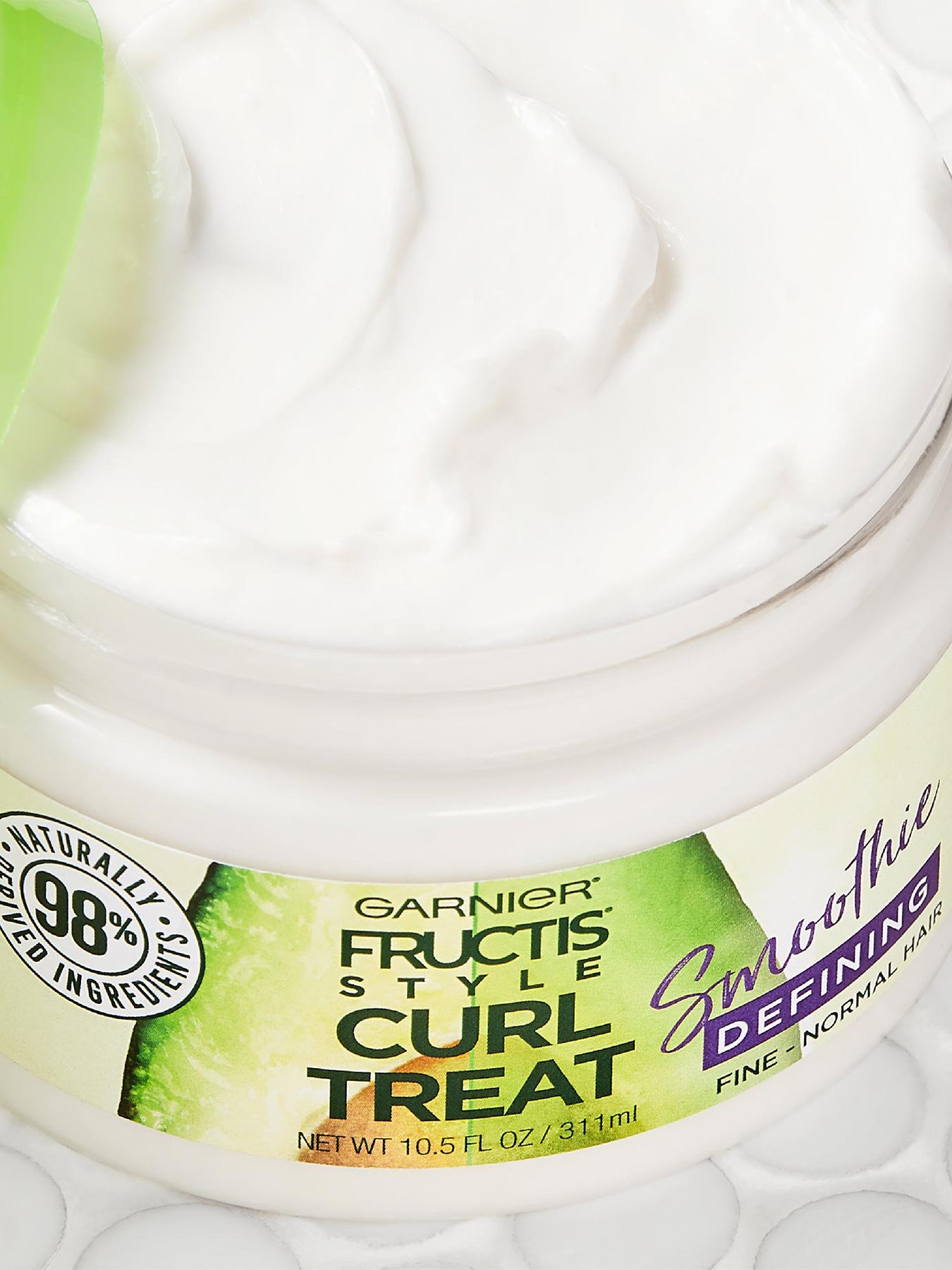 Close up view of Curl Treat Smoothie Defining Leave-in Styler for Soft Curls.